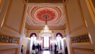 People stand in the hall as vaccinations against the coronavirus disease (COVID-19) take place at the Bavarian State Opera House in Munich, Germany, February 10, 2022. REUTERS/Michaela Rehle/File Photo