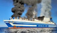Smoke rises from the Italian-flagged Grimaldi Euroferry Olympia that caught fire off the coast of Corfu island, Greece, February 18, 2022, in this picture obtained from social media. Nikos Bardis ? debater.gr/via REUTERS
