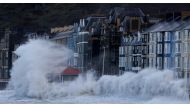 Waves caused by Storm Eunice break over Aberystwyth promenade in Aberystwyth, Wales, Britain, February 18, 2022. REUTERS/Carl Recine