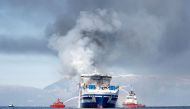 Smoke rises from the Italian-flagged Euroferry Olympia, which sailed from Greece to Italy early on Friday and caught fire, off the coast of Corfu, Greece, February 19, 2022. REUTERS/Guglielmo Mangiapane 