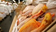 FILE PHOTO: Cases of chickens and other poultry displayed for sale at a market near Paris, February 21, 2006. REUTERS/Franck Prevel

