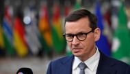 Poland’s Prime Minister Mateusz Morawiecki speaks with the media as he arrives for the EU-Africa summit at the European Council building in Brussels, Belgium February 17, 2022. Geert Vanden Wijngaert/Pool via REUTERS/File Photo