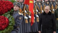 Russian President Vladimir Putin takes part in a wreath laying ceremony at the Tomb of the Unknown Soldier by the Kremlin Wall on the Defender of the Fatherland Day in Moscow, Russia February 23, 2022. Sputnik/Aleksey Nikolskyi/Kremlin via Reuters