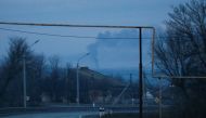Smoke rises over the area near the town of Chasiv Yar in the Donetsk region, Ukraine February 24, 2022. REUTERS/Gleb Garanich
