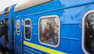 People waiting for an second train to board, reflect on a leaving a evacuation train from Kyiv to Lviv at Kyiv central train station, Ukraine, February 25, 2022. REUTERS/Umit Bektas