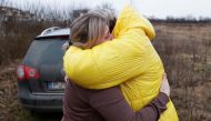 People fleeing from Ukraine embrace as they arrive in Hungary, after Russia launched a massive military operation against Ukraine, at a border crossing in Beregsurany, Hungary, February 26, 2022. REUTERS/Bernadett Szabo