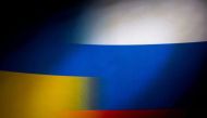Russia's and Ukraine's flags are seen printed on paper in this illustration taken January 27, 2022. REUTERS/Dado Ruvic/Illustration


