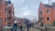Police and State Emergency Service (SES) officers work at the scene where several houses have been damaged by an explosion, following an air strike in Bila Tserkva, Kyiv Oblast, Ukraine March 5, 2022 in this picture obtained from social media. Kyiv Oblast Police