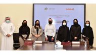 Officials from the QU and talabat at the MoU signing event.