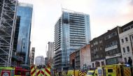Emergency services' members work at a fire site in East London, Britain, March 7, 2022. REUTERS/Henry Nicholls
