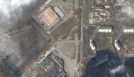 A satellite image shows heavily damaged shopping mall and other stores, amid Russia's ongoing invasion of Ukraine, in Mariupol, Ukraine, March 9, 2022. Satellite image ©2022 Maxar Technologies/Handout via REUTERS