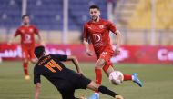 Al Arabi’s Youssef Msakni in action against an Umm Salal player, yesterday. 