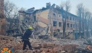 A rescuer works among remains of buildings damaged by an airstrike, as Russia's attack on Ukraine continues, in Dnipro, Ukraine, in this handout picture released March 11, 2022. Press service of the State Emergency Service of Ukraine/Handout via REUTERS