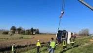 Firefighters work at the scene of an accident where a bus crashed while carrying Ukrainian citizens, near Cesena, Italy, March 13, 2022. Polizia di Stato/Handout via REUTERS