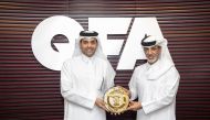 Sheikh Mohammed bin Abdulla Al Thani (left), Chief Executive Officer of Ooredoo Qatar, and Sheikh Hamad bin Khalifa bin Ahmad Al Thani, President of QFA, exchanging commemorative plaques.
