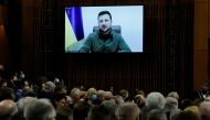 Members of the House of Commons and Senate listen as Ukraine's President Volodymyr Zelenskiy, who appears on a screen, addresses Canada's parliament in Ottawa, Ontario, Canada March 15, 2022. REUTERS/Patrick Doyle
