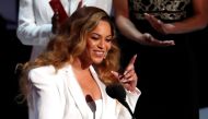 Beyonce reacts after winning the entertainer of the year award. REUTERS/Mario Anzuoni