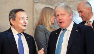 Italy's Prime Minister Mario Draghi stands next to British Prime Minister Boris Johnson before a NATO summit to discuss Russia's invasion of Ukraine at the alliance's headquarters in Brussels, Belgium, March 24, 2022. REUTERS.