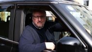 London black cab driver Matt Westfall, 52, poses for a photo during a Reuters interview in London, Britain, March 28, 2022. Picture taken March 28, 2022. REUTERS/Tom Nicholson