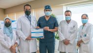 Dr. Khalid Al Rumaihi (centre) is being honoured as one of the pioneers in the use of Rezum treatment for patients with an enlarged prostate.