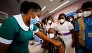 Director General of the Ghana Health Service Dr. Patrick Kuma-Aboagye receives the coronavirus disease (COVID-19) vaccine during the vaccination campaign at the Ridge Hospital in Accra, Ghana March 2, 2021. REUTERS/Francis Kokoroko/File Photo


