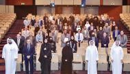 Ministry and UDST officials with training programme participants at the closing ceremony. 