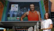 Iga Swiatek (POL) poses for a portrait with the Butch Buchholz Championship Trophy after the women's singles final in the Miami Open at Hard Rock Stadium. Geoff Burke-USA Today Sports
