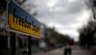 A sign reading 'Freedom Square' in the national colours of Ukraine is set up near the Russian embassy, as Russia's invasion of Ukraine continues, in Berlin, Germany, April 5, 2022. Reuters/Lisi Niesner