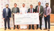 Lulu Hypermarket and QSRSN officials on the occasion of cheque handover. 