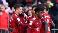 Bayern Munich's Robert Lewandowski celebrates scoring their first goal with teammates REUTERS/Lukas Barth