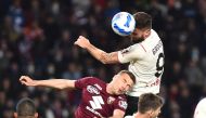 AC Milan's Olivier Giroud in action with Torino's Alessandro Buongiorno REUTERS/Massimo Pinca