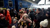 People fleeing Russia's invasion of Ukraine gather at the train station in Lviv, Ukraine, March 9, 2022. REUTERS/Pavlo Palamarchuk/File Photo