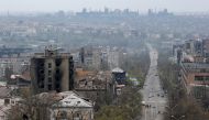 A view shows damaged buildings, with the Azovstal Iron and Steel Works plant in the background, in the southern port city of Mariupol, Ukraine April 19, 2022. REUTERS/Alexander Ermochenko/File Photo