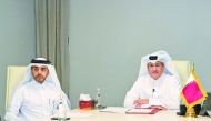 Mohammed Faleh Al Hajri (right) in charge of Qatar Civil Aviation Authority (QCAA) with another official during the signing of the MoU.