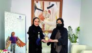 Dreama and Masraf Al Rayan officials during an event. 