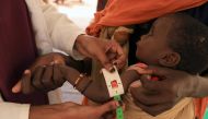 A health worker takes a measurement of 8-month-old Abdurahman Bishar, at a clinic for malnourished children, at the Higlo camp for people displaced by drought, in the town of Gode, Somali Region, Ethiopia, April 26, 2022. Pictures taken April 26, 2022. REUTERS/Tiksa Negeri