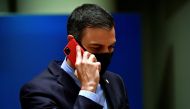 Spain's Prime Minister Pedro Sanchez talks on the phone during the first face-to-face EU summit since the coronavirus disease (COVID-19) outbreak, in Brussels, Belgium July 20, 2020. John Thys/Pool via Reuters/File Photo