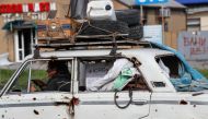 A man transports his belongings in a car in the southern port city of Mariupol, Ukraine on May 3, 2022. (Reuters/Alexander Ermochenko)