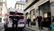 French police officers stand in front of the Chanel store following a robbery, next to the Place Vendome in Paris, France, May 5, 2022. REUTERS/Christian Hartmann
