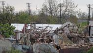 A local resident walks past houses destroyed during Ukraine-Russia conflict in the southern port city of Mariupol, Ukraine May 5, 2022. Picture taken May 5, 2022. REUTERS/Alexander Ermochenko
