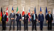 FILE PHOTO: Canada's Prime Minister Justin Trudeau, U.S. President Joe Biden, German Chancellor Olaf Scholz, Britain's Prime Minister Boris Johnson, France's President Emmanuel Macron, Japan's Prime Minister Fumio Kishida and Italy's Prime Minister Mario Draghi pose for a family photo during the G7 summit in Brussels, Belgium, March 24, 2022. Michael Kappeler /Pool via REUTERS
