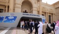 Visitors line up at the security check point as they arrive to attend the Future Aviation Forum in Riyadh, Saudi Arabia, May 9, 2022. REUTERS.