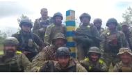 Ukrainian troops stand at the Ukraine-Russia border in what was said to be the Kharkiv region, Ukraine in this screen grab obtained from a video released on May 15, 2022. Ukrainian Ministry of Defence/Handout via REUTERS