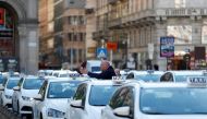 Taxi drivers wait for customers at Duomo square, as their services have been losing business since the country's coronavirus outbreak, in Milan, Italy February 28, 2020. REUTERS/Yara Nardi/File Photo
