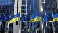 FILE PHOTO: Flags of European Union and Ukraine flutter outside EU Parliament building, in Brussels, Belgium, February 28, 2022. REUTERS/Yves Herman/File Photo

