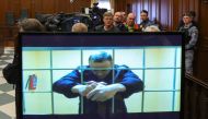 Jailed Russian opposition leader Alexei Navalny is seen on a screen during a court hearing in Moscow. Reuters