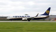 A Ryanair aircraft lands on the southern runway at Gatwick Airport in Crawley, Britain, August 25, 2021. REUTERS/Peter Nicholls/File Photo