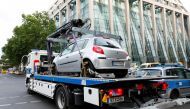 A car that crashed into a group of people near Breitscheidplatz is towed away from the scene, in Berlin, Germany, June 8, 2022. Reuters/Michele Tantussi