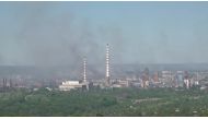 Black smoke billows over Sievierodonetsk Azot chemical plant as Russia's invasion on Ukraine continues, in Sievierodonetsk, Luhansk Region, Ukraine, in this still image obtained from a handout video released on June 9, 2022. Luhansk Region Police