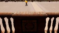 A person covers herself from the sun with an umbrella during the first heatwave of the year in Seville, Spain June 11, 2022. REUTERS/Marcelo del Pozo